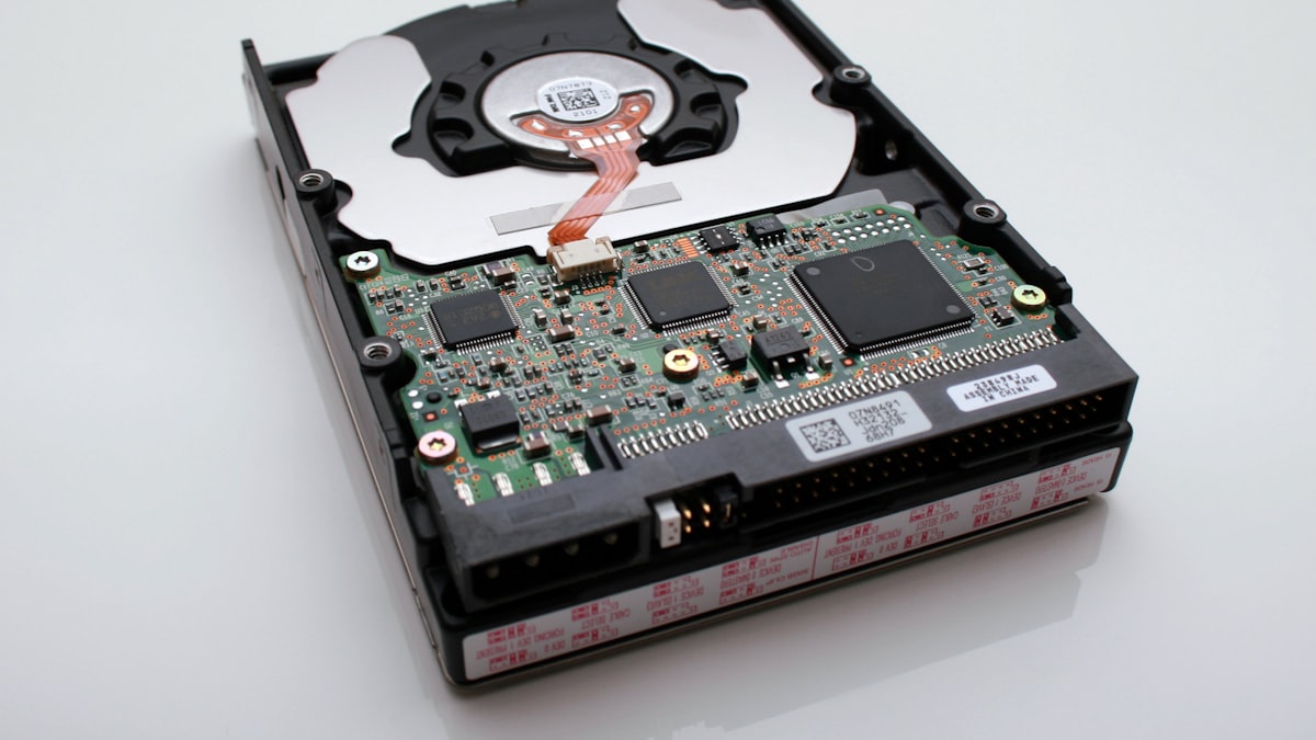 Macro photograph of an internal hard drive circuit board and chassis